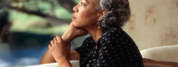 ek-home-page-banner-2b-sm an older woman thinking about fine designer jewelry