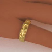 An 18k yellow gold ring with detail on top of the gold band of this designer pinky ring. This classic fine jewelry is designed by a local New York City designer named Ezzykaia and is seen on the online fine jewelry shopping boutique.