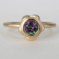 a contemporary 14k yellow gold ring designed with a mystic green topaz gemstone.This original designgold single band ringcan be worn as a double stackable ring or alone as a single band. This fine jewelry and other designs are sold on ezzykaia’s online high-end boutique with free shipping.
